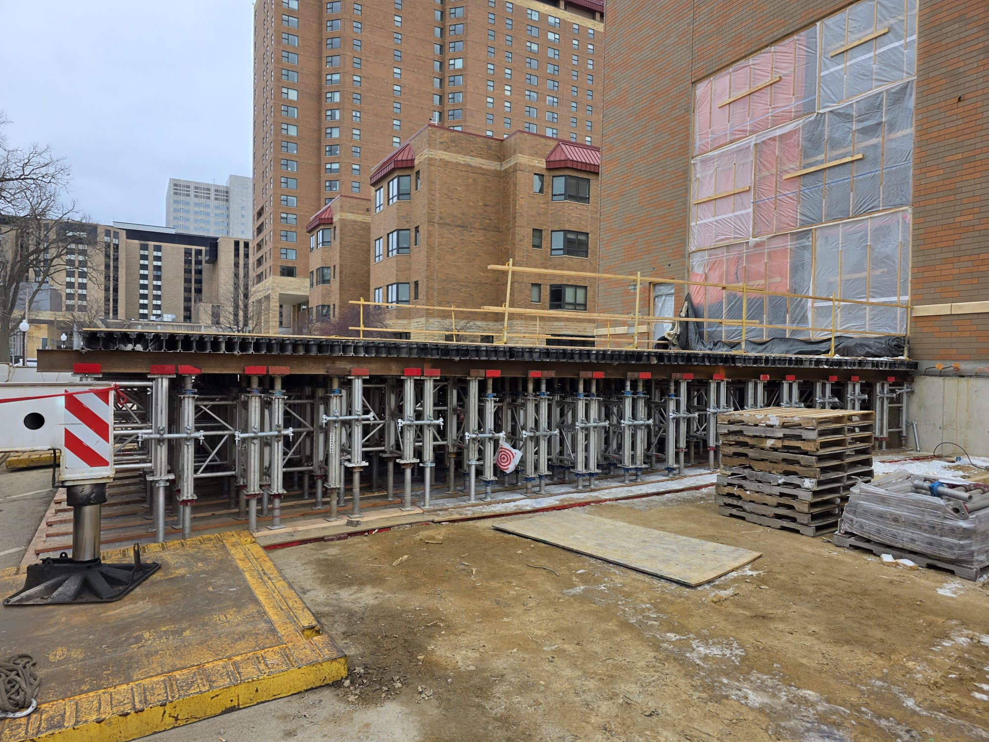 Equipment drive lane shoring system supporting overhead loads at Crossing at Inver Woods