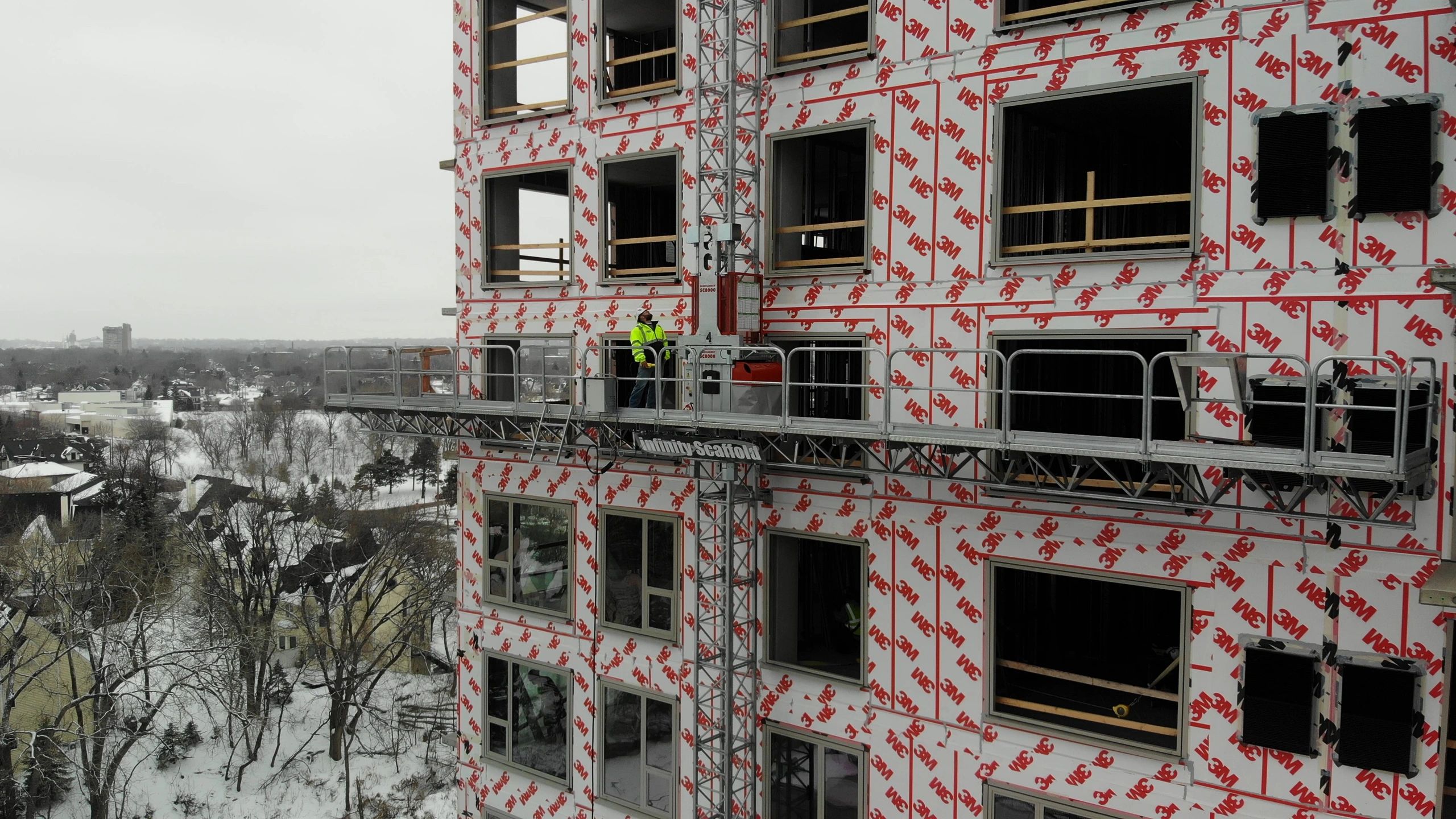 Mast climber scaffolding on construction site
